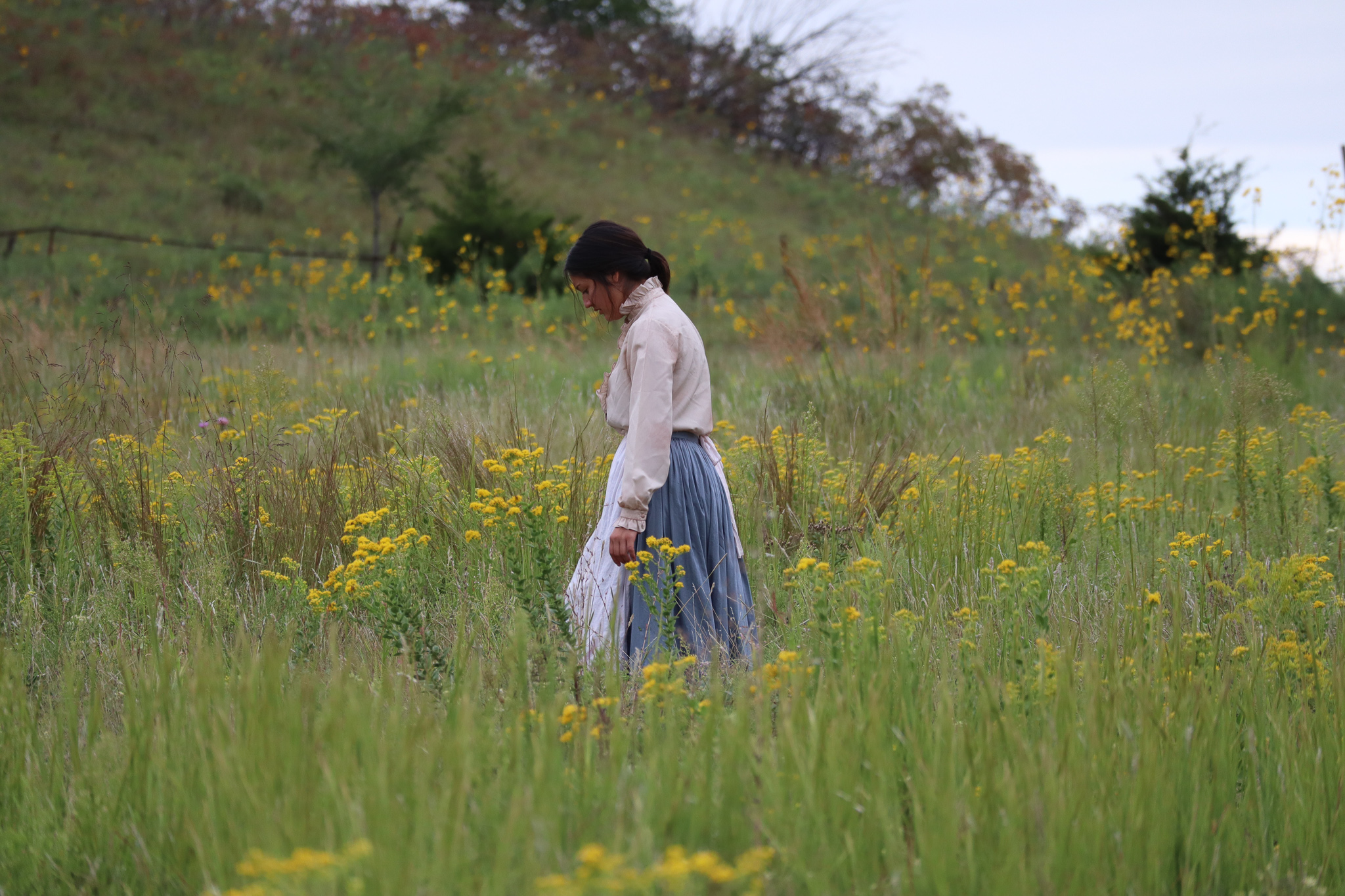 Woman standing in prairie