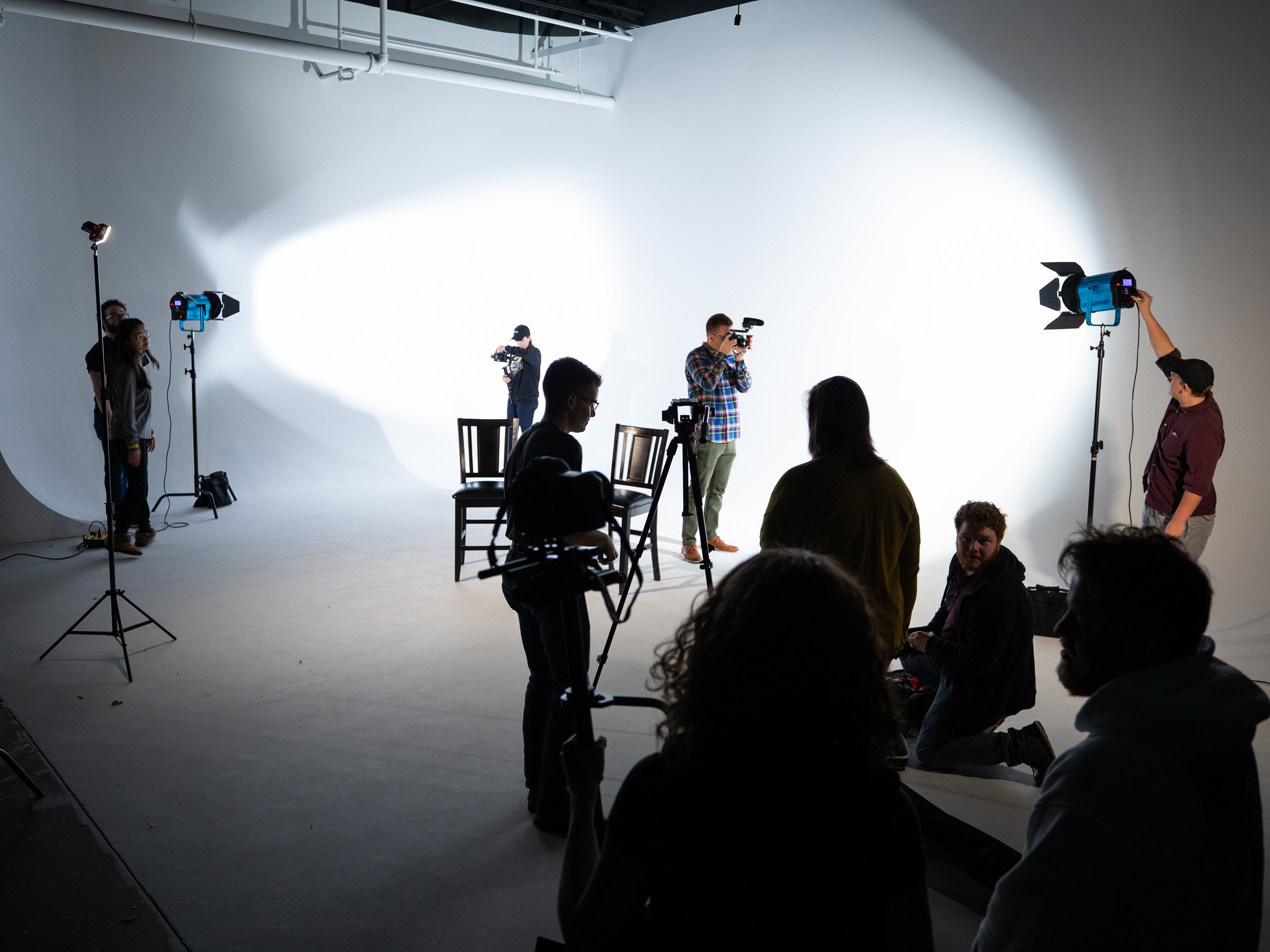 Filmmaking green room studio. Group of students in film studio