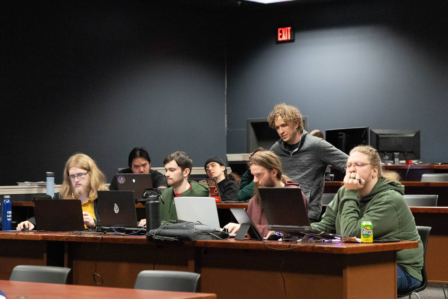 Students working on a laptop.