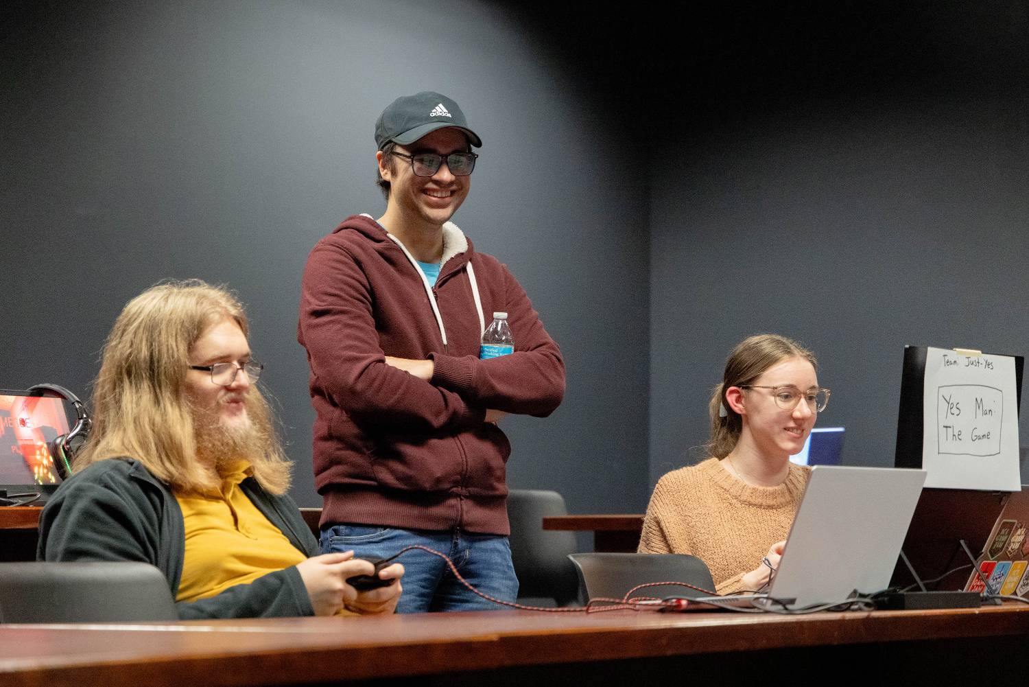 Students working on a laptop.