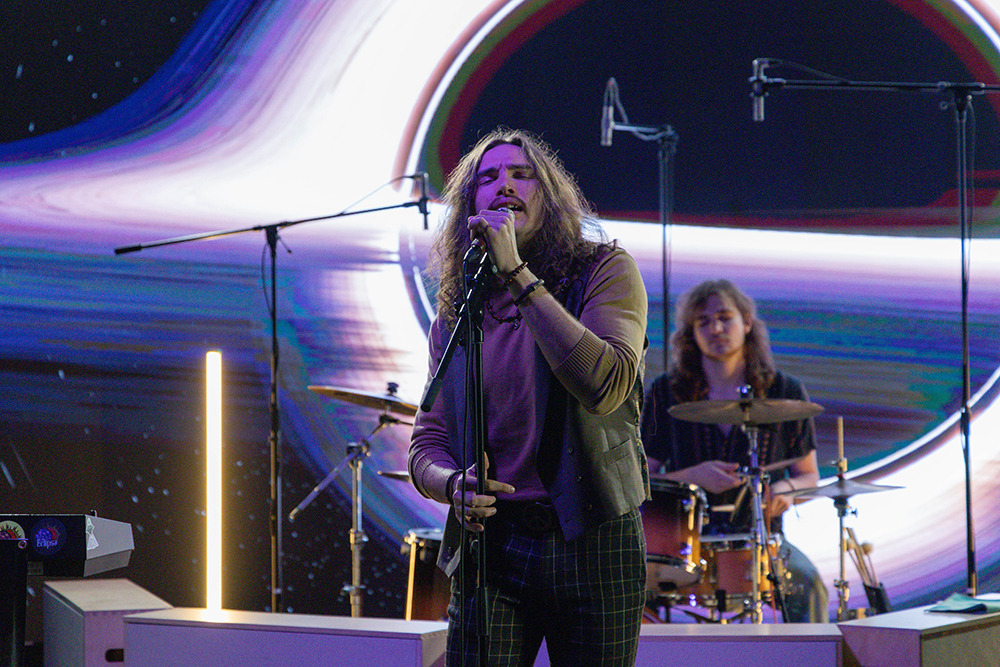 Wichita band Eclipse in front of the LED screen.