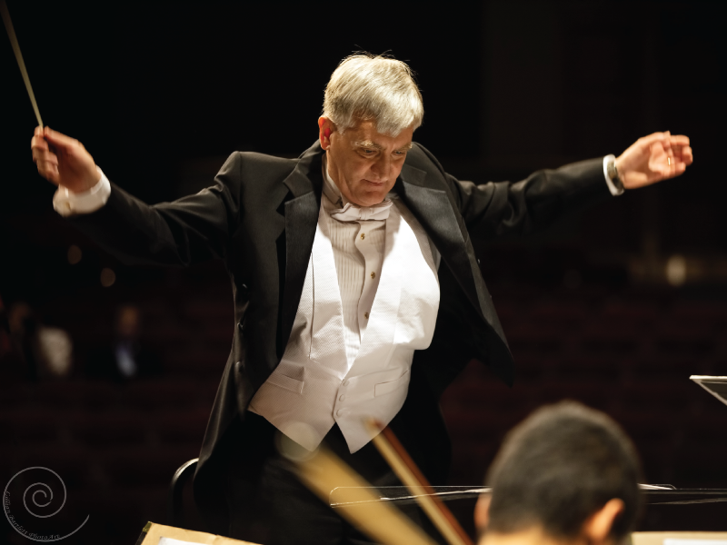 a photo of dr. mark laycock conducting