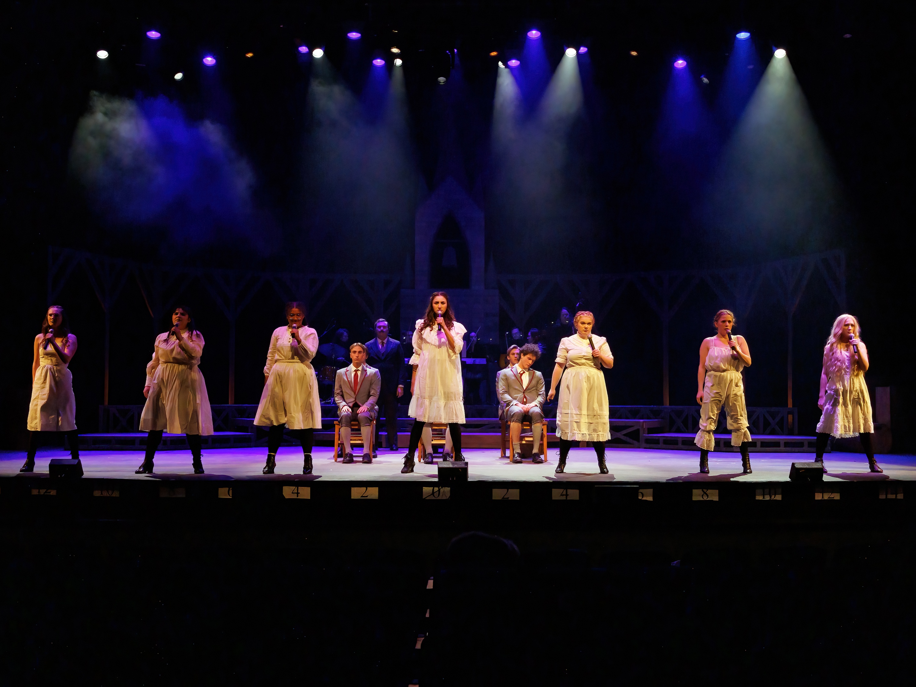 women singing on stage