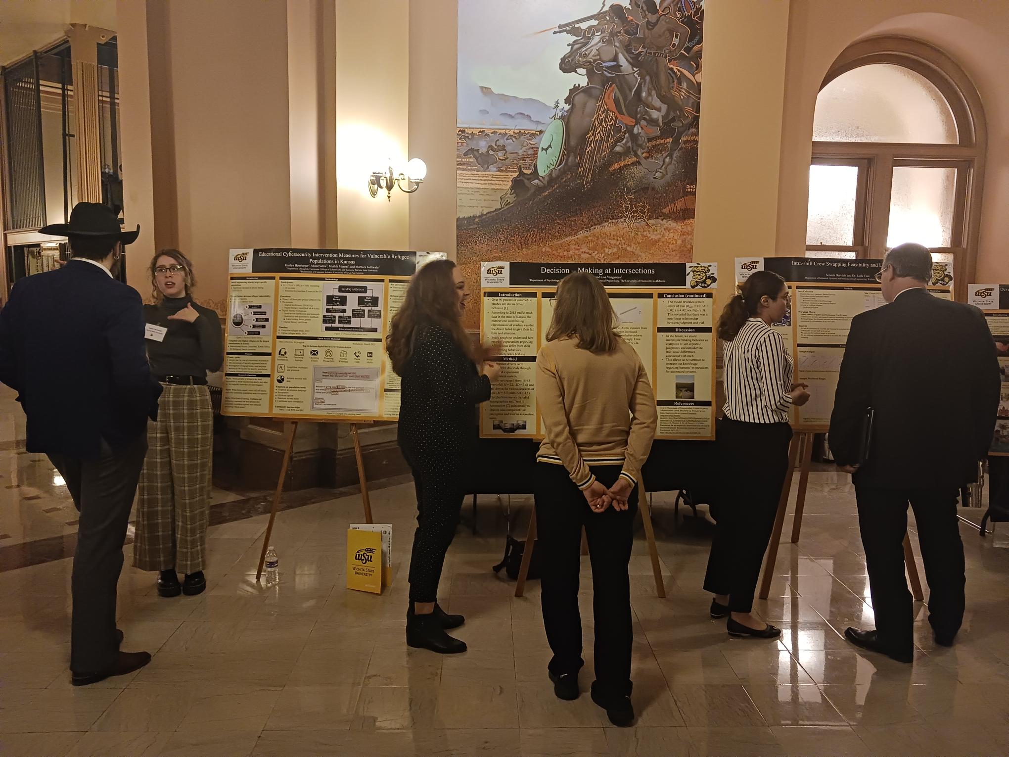 WSU grad students presenting their posters at the Capitol Graduate Research Summit