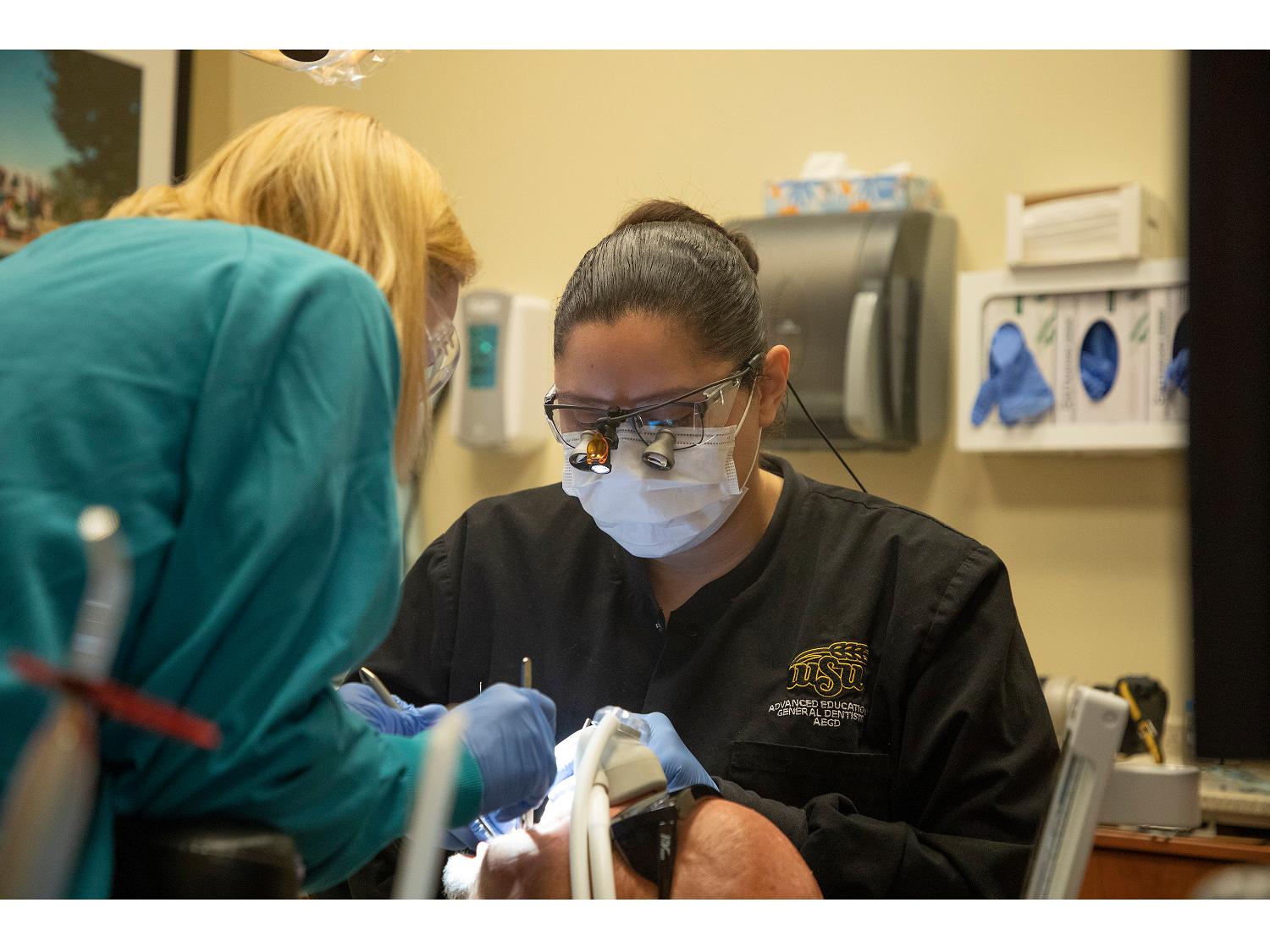 dental resident working on patient