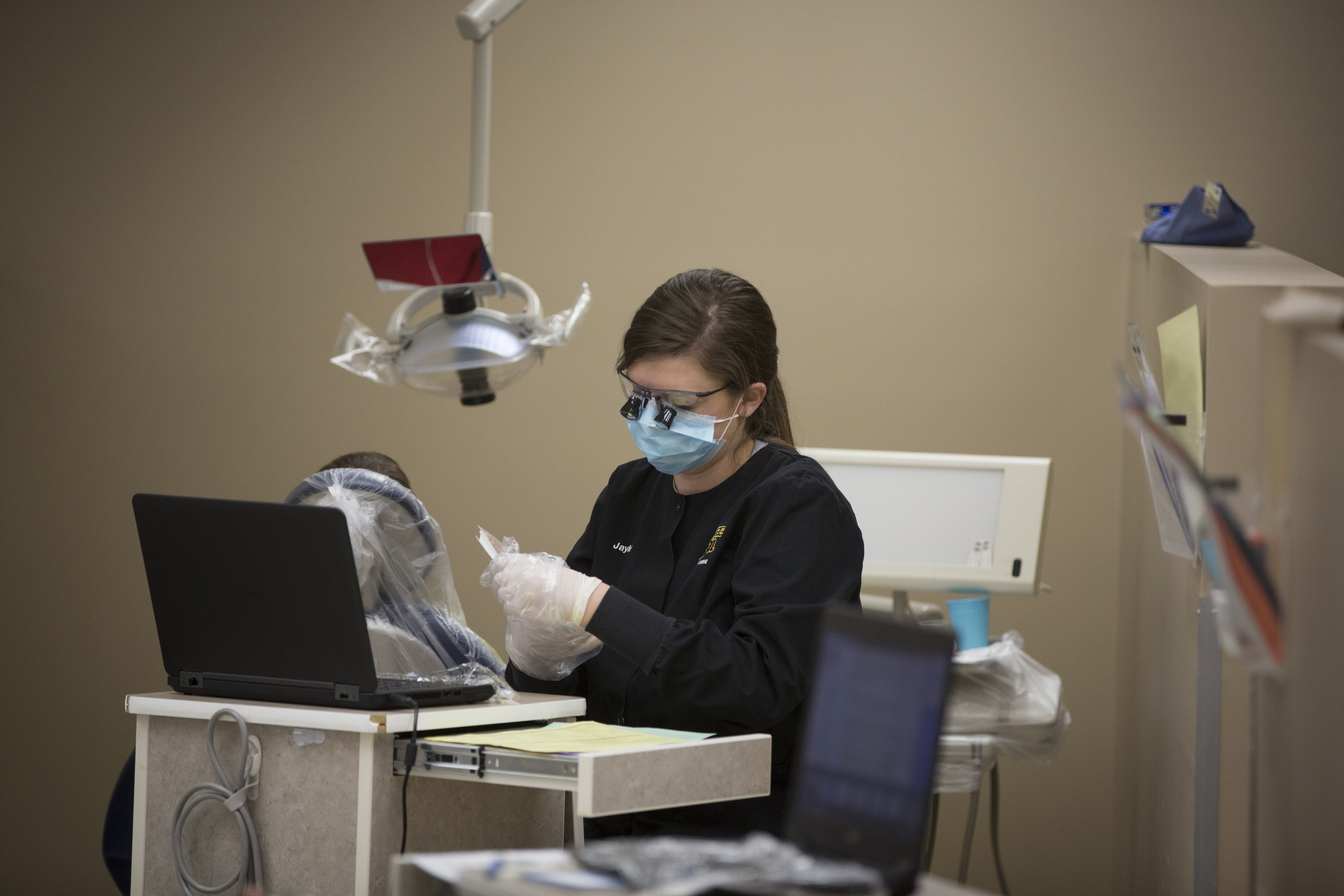 dental hygiene student preparing for patient
