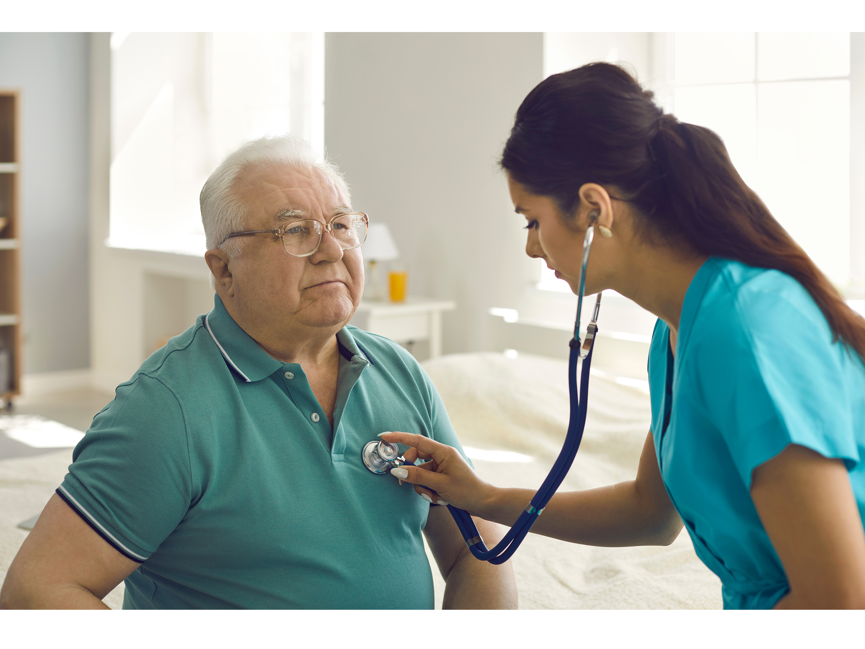 Older male patient with practicing nursing student