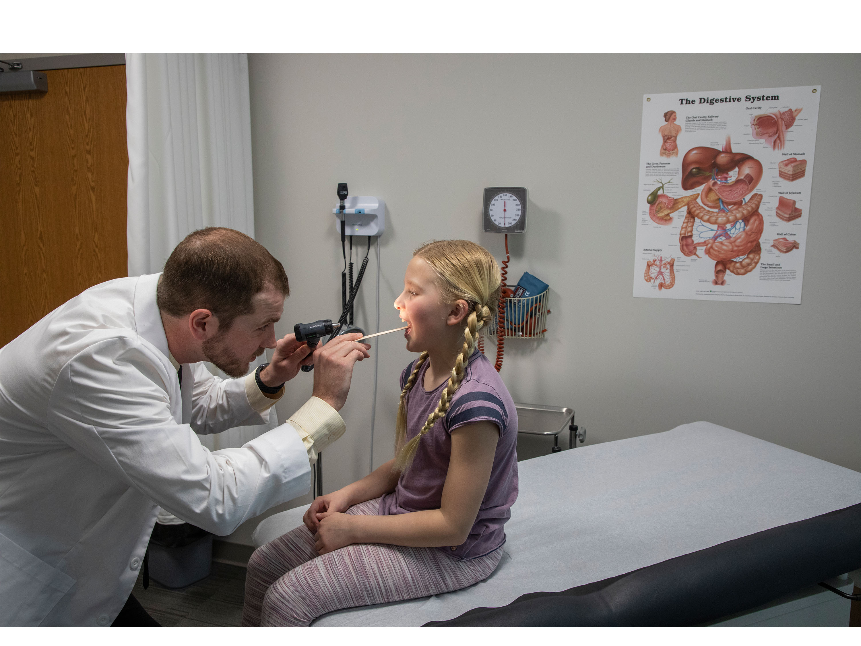 Physician Assistant student examines child