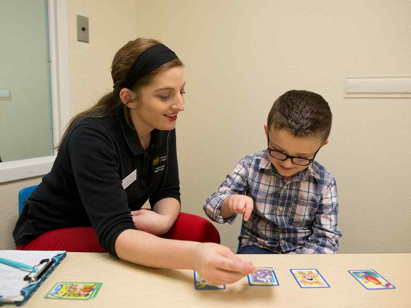 CSD student works with elementary aged child
