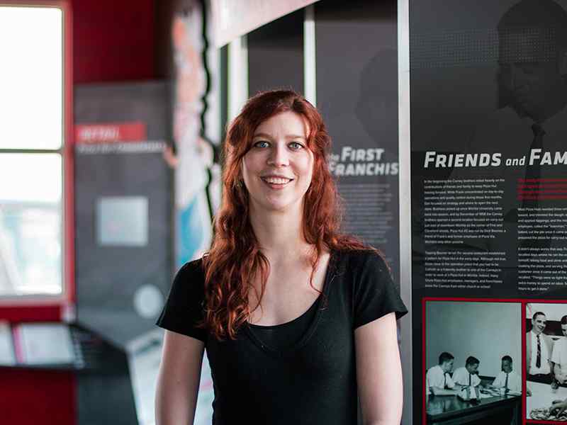 Claire Weatherall, a museum studies major, gets hands on experience in the Pizza Hut museum.