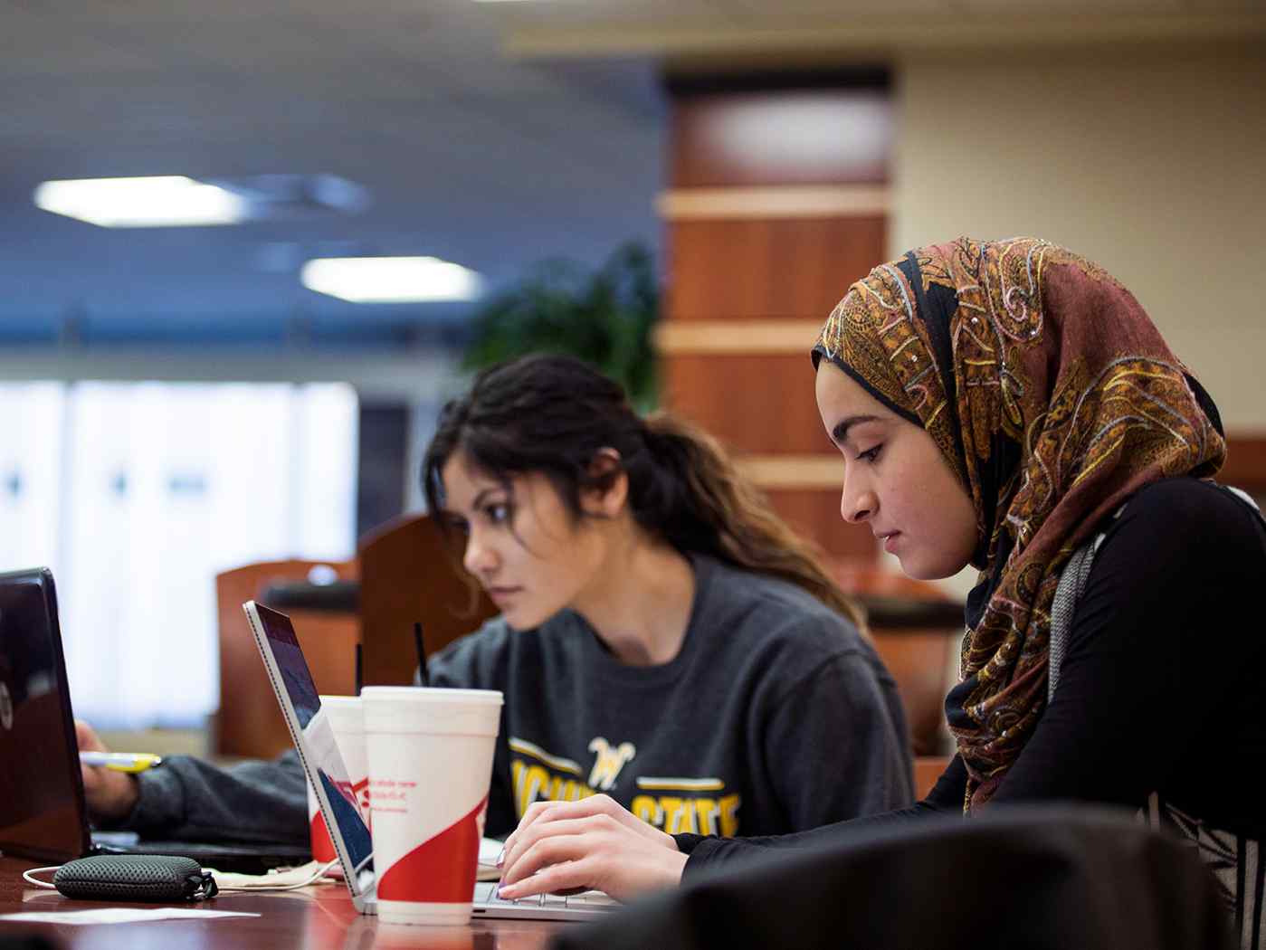 Two women study in the Rhatigan Student Center