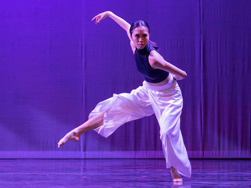 Student dancer performs on stage.