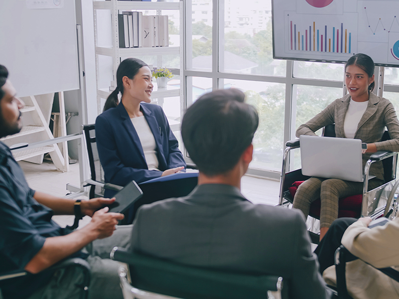 A small group of health care professionals meet.