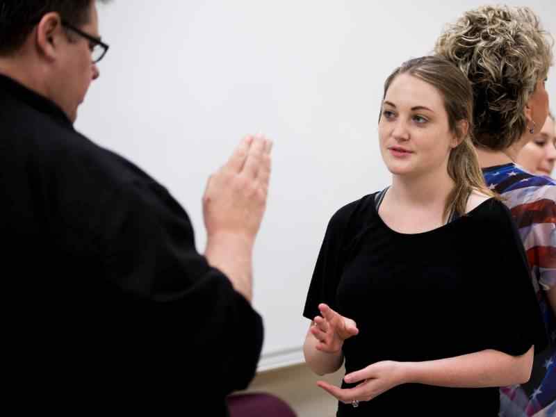 Students practicing sign language in classroom at WSU West.