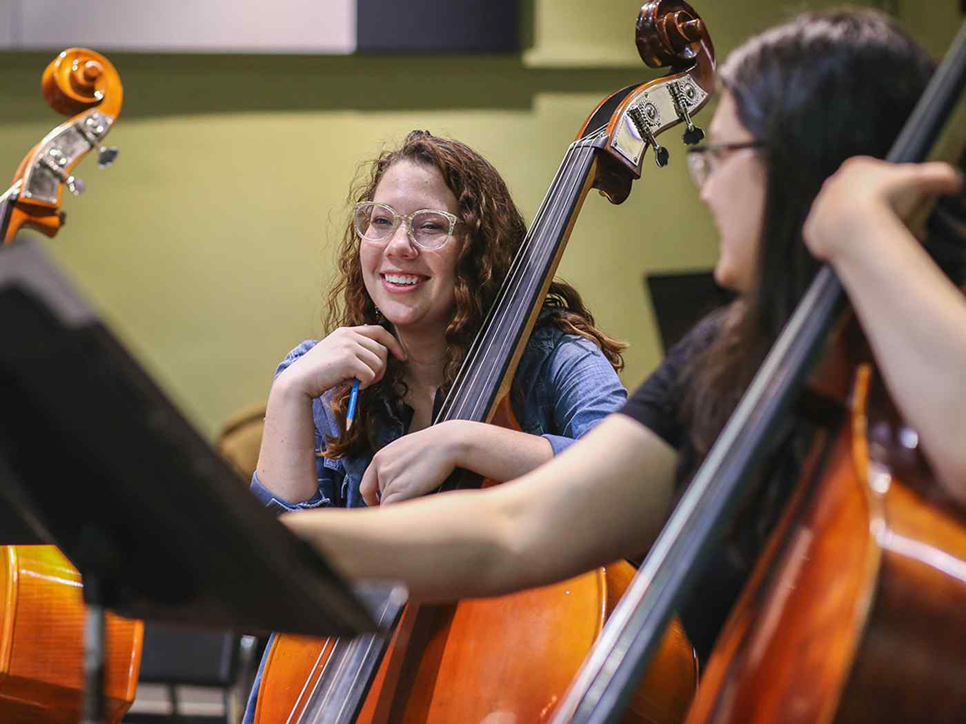 Female Symphony student smiling.