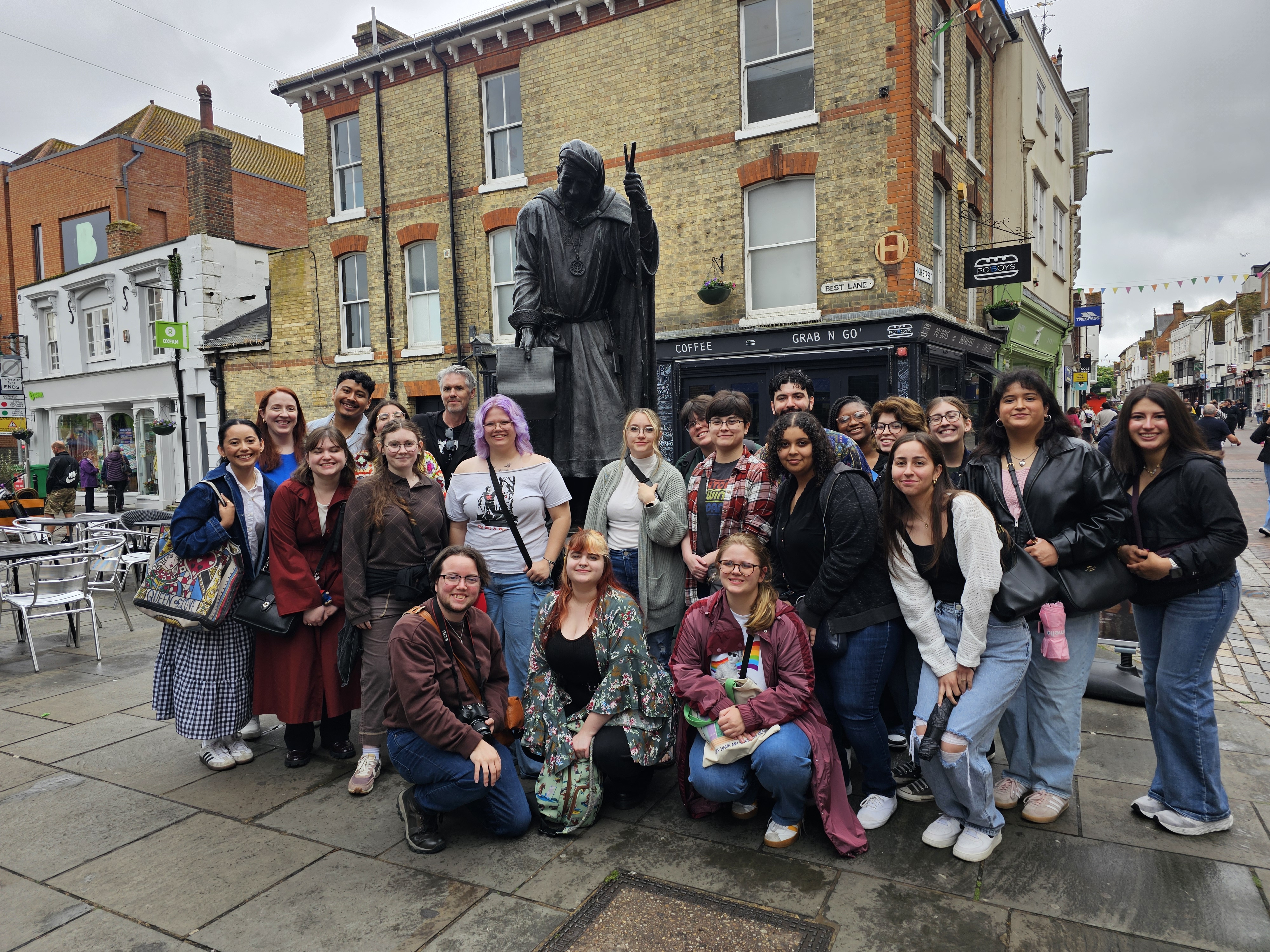 Student group in front of statue