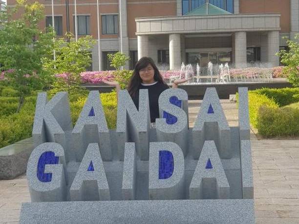 Student at Kansai Gaidai University sign