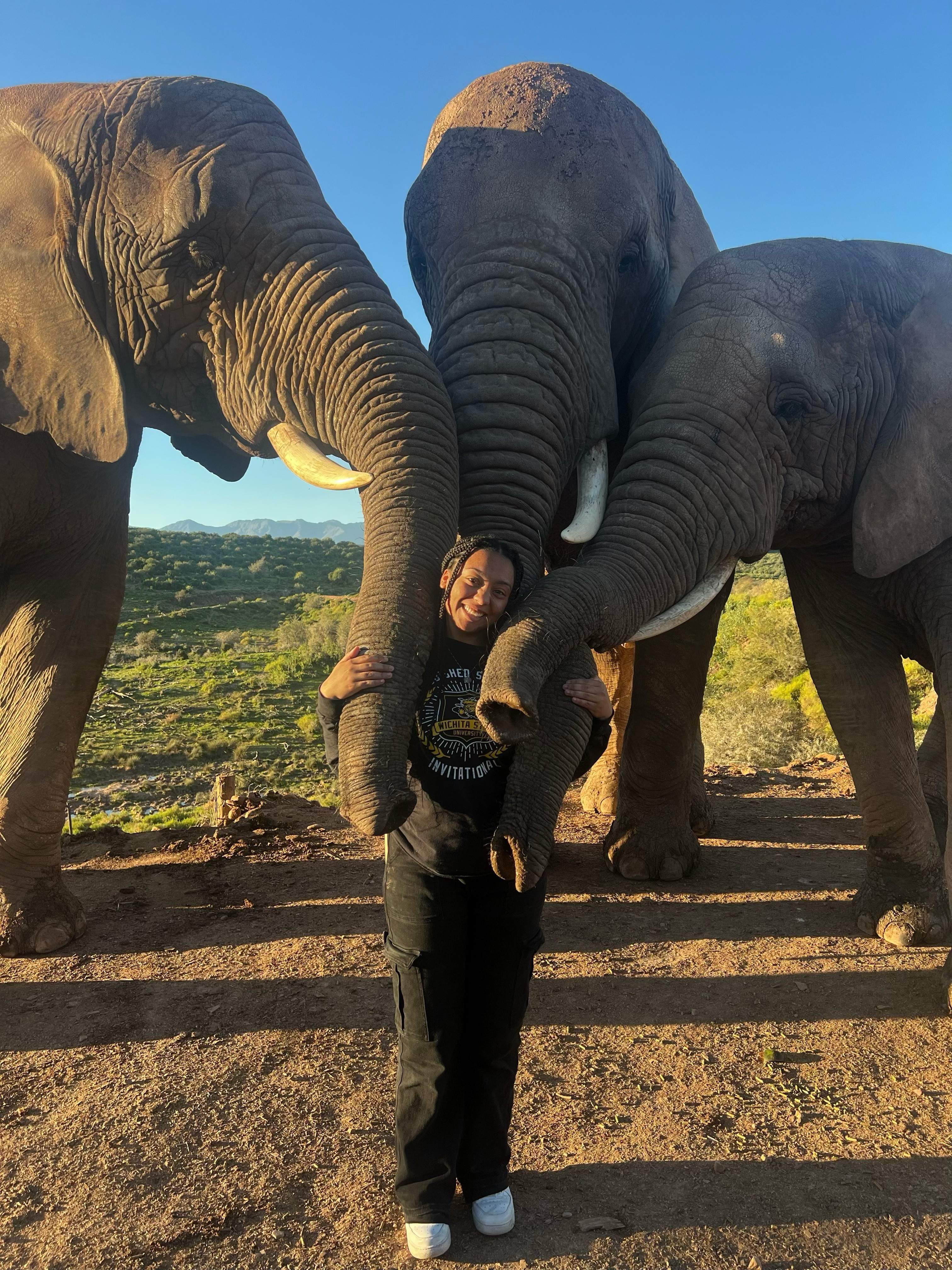 Jocelyn hugged by elephants