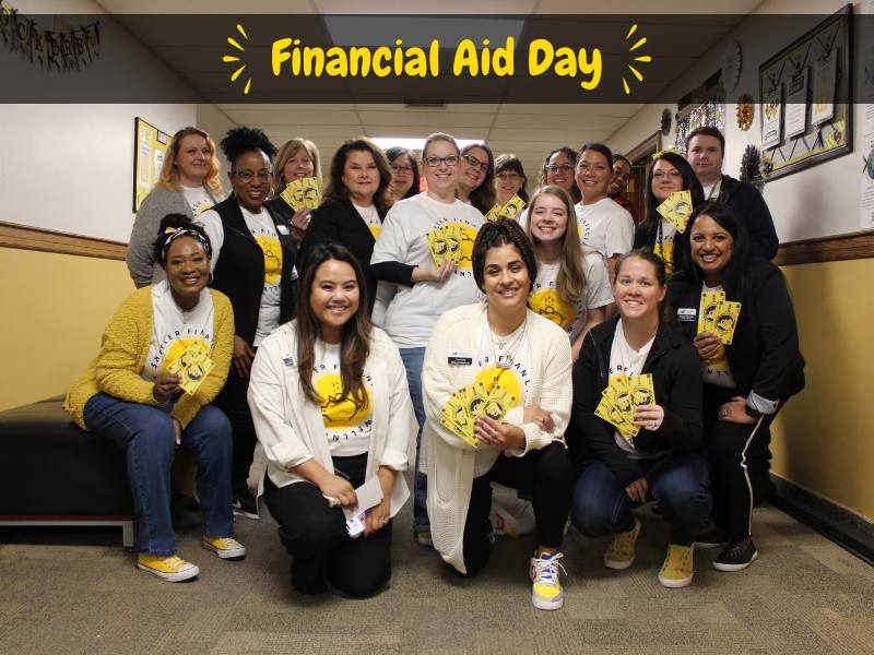 Decorative header for Financial Aid Day - staff holding decorative Shocker-themed money