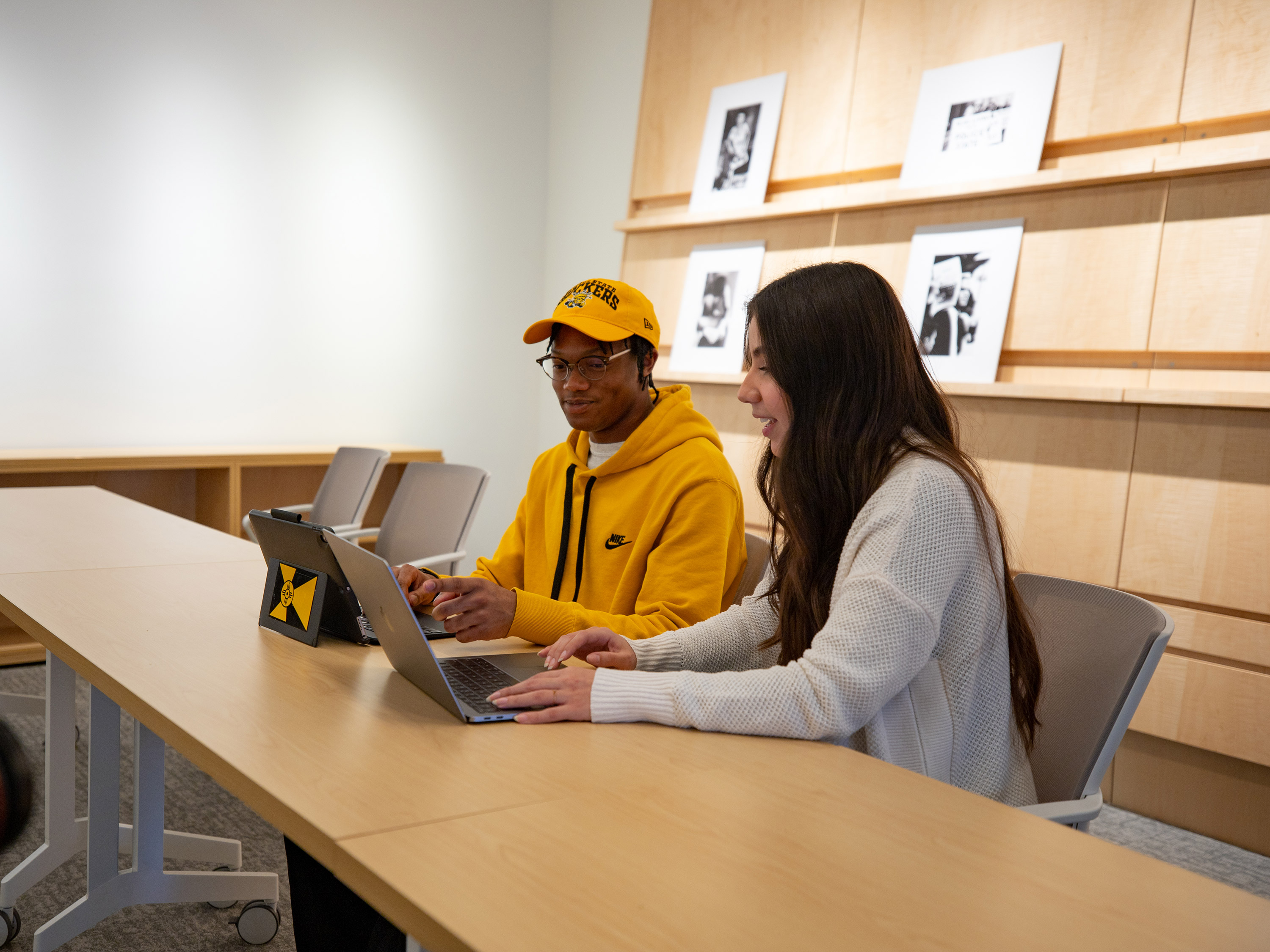 Two students collaborate in the Ulrich Museum's study center.