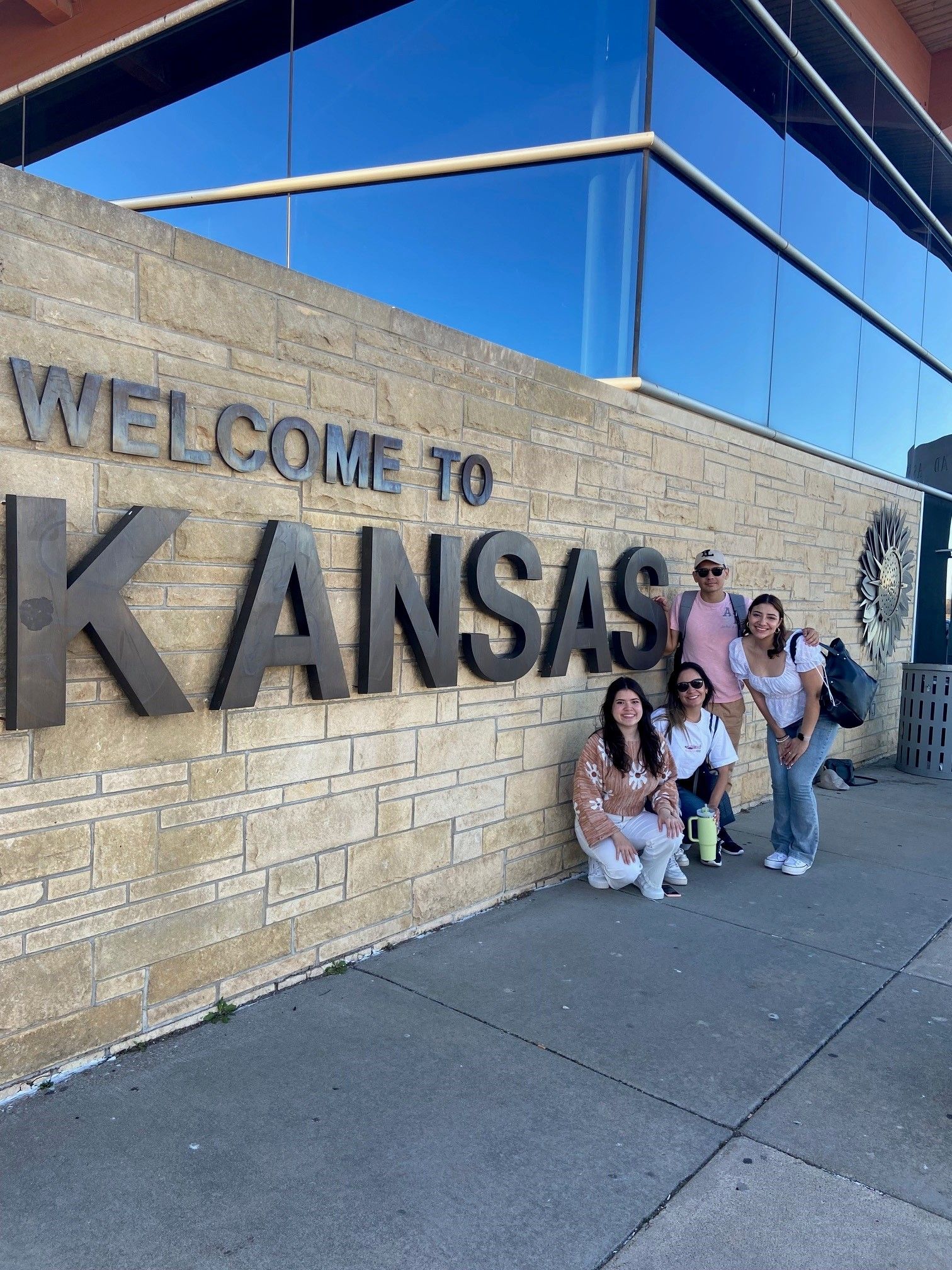 Students with Kansas sign