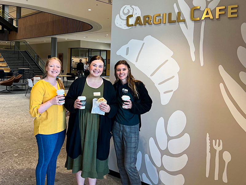 Rosie Krenek, Baylee Almos, and Brittan Schmitz try items at the Cargill Café.