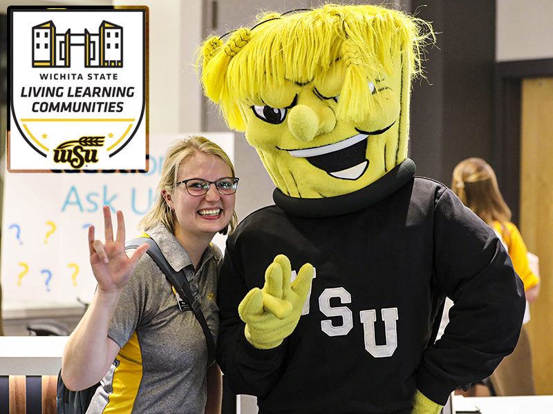 A member of Wichita State Housing and Wu pose for a photo.