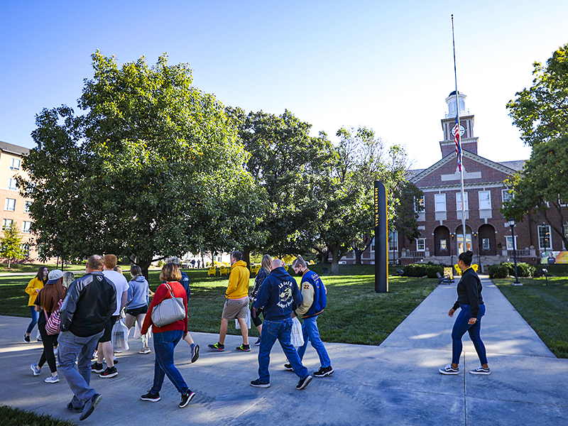 Students walk in front of the Morrison Hall.