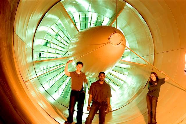 Aerspace Students Stand in Jet Engine