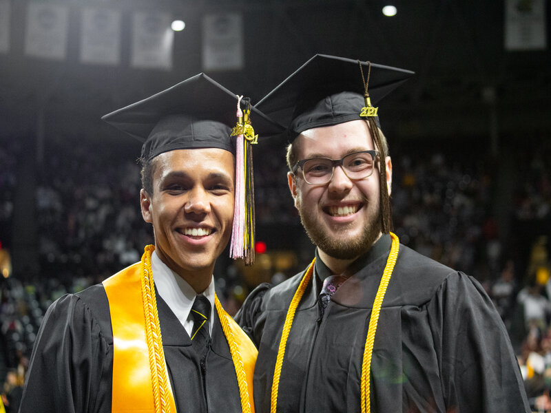 Students posing for a photo at commencement ceremony
