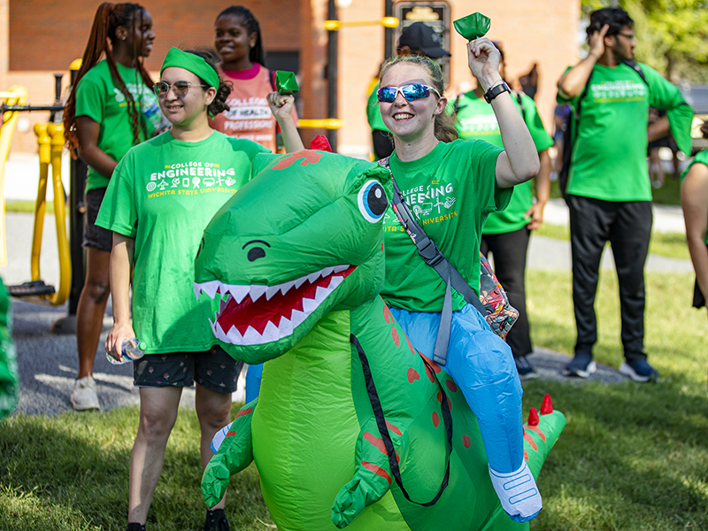 Abby Otten, Dino Lady, reps the College of Engineering during Clash 2023.