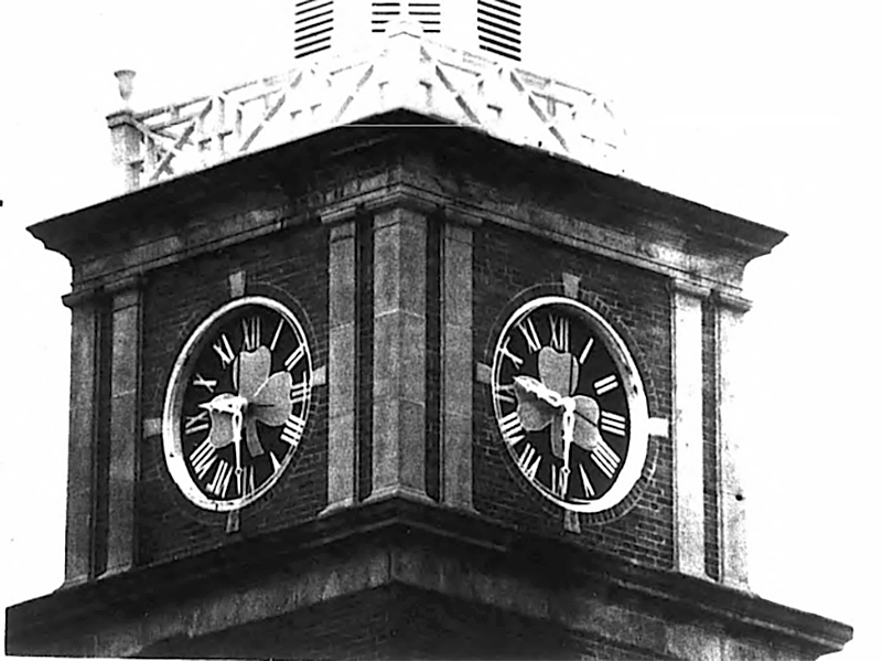 Shamrocks atop Morrison Hall's clock tower.