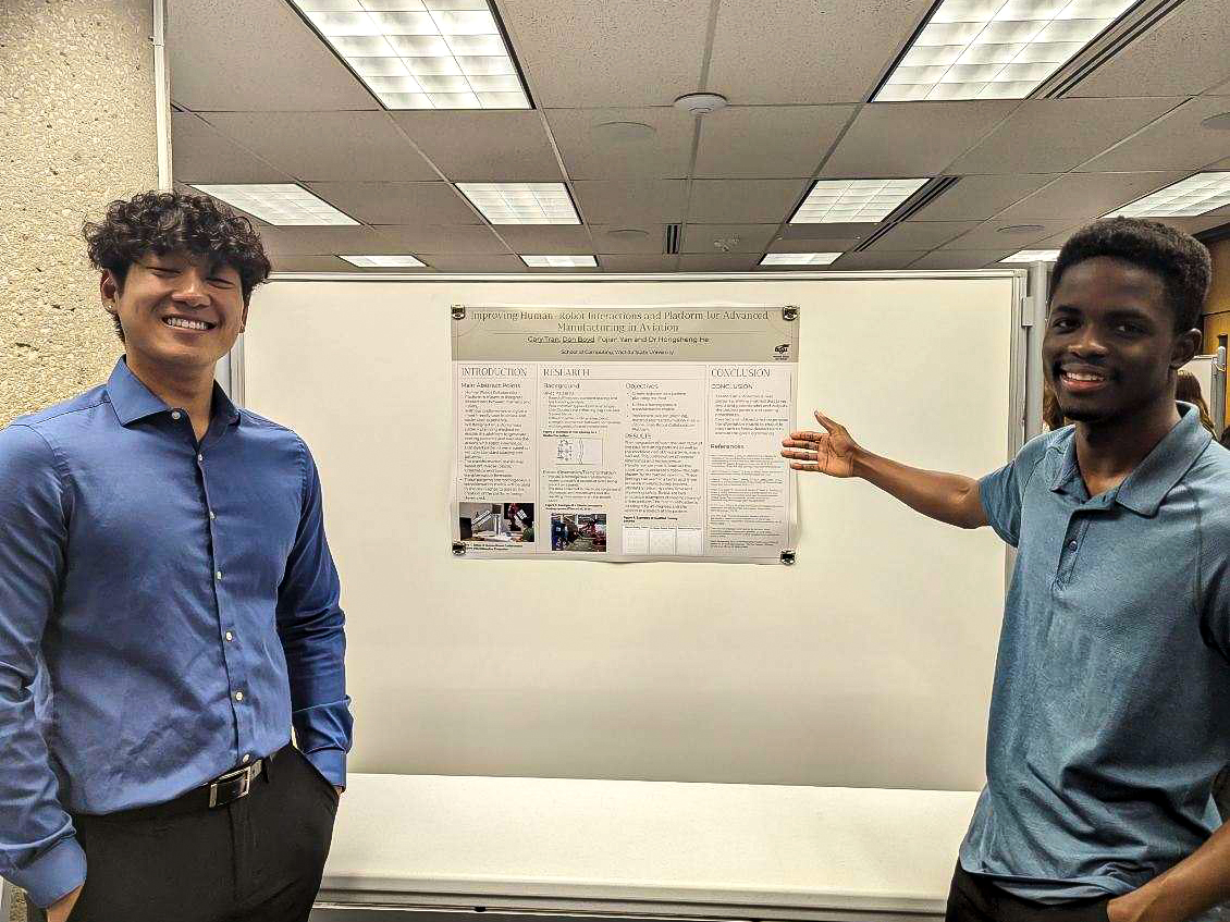 Gary Tran and Don Boyd present their research during the FYRE in STEM Research Showcase on May 8, 2023 in Ablah Library.