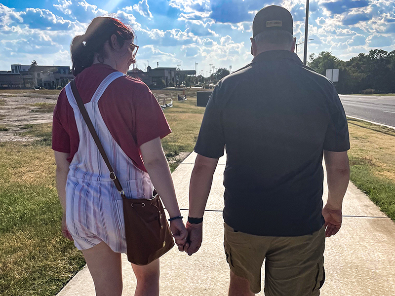 Ainsley and her father walking on Wichita State's campus.