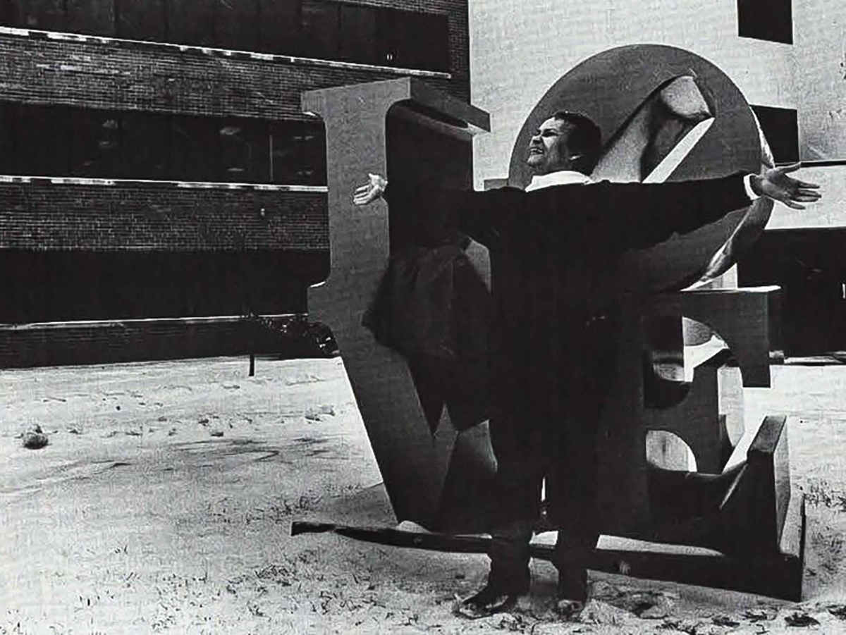 Longtime Wichita State counselor and instructor LaVona Spencer poses with the LOVE sculpture for the 1985 Parnassus.