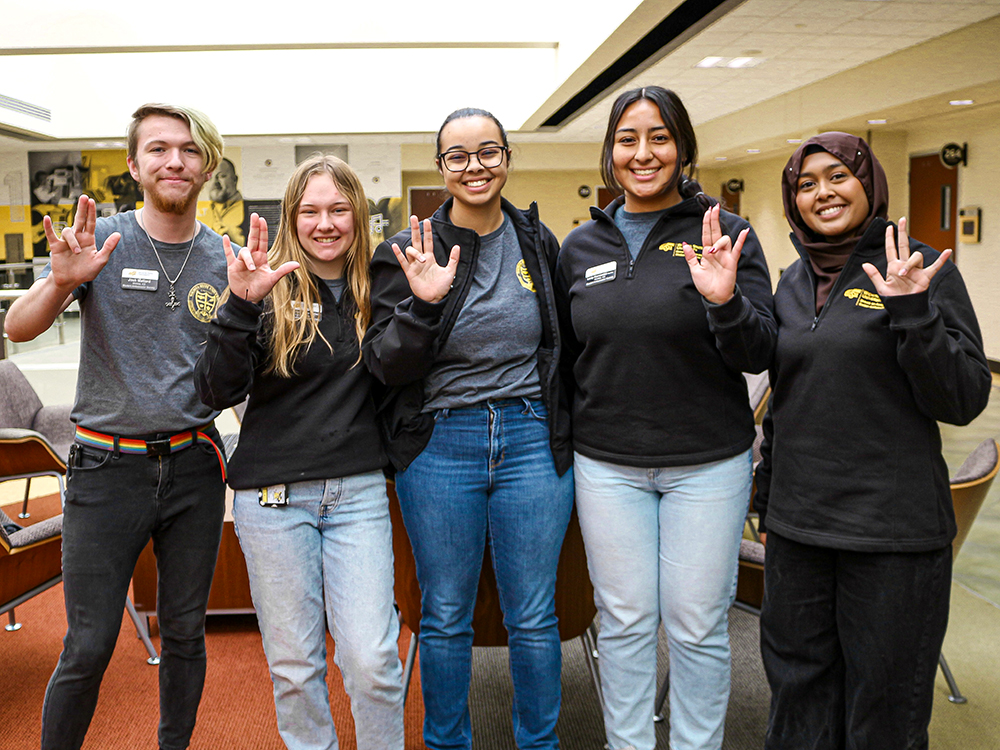 SAS members Josh Mallard, Kaelyn Schroeder, Maya Douglas, Lesly Hernandez and Sameeha Rashid pose for a photo during the 2025 Student Ambassador Society Leadership Conference in the Rhatigan Student Center.