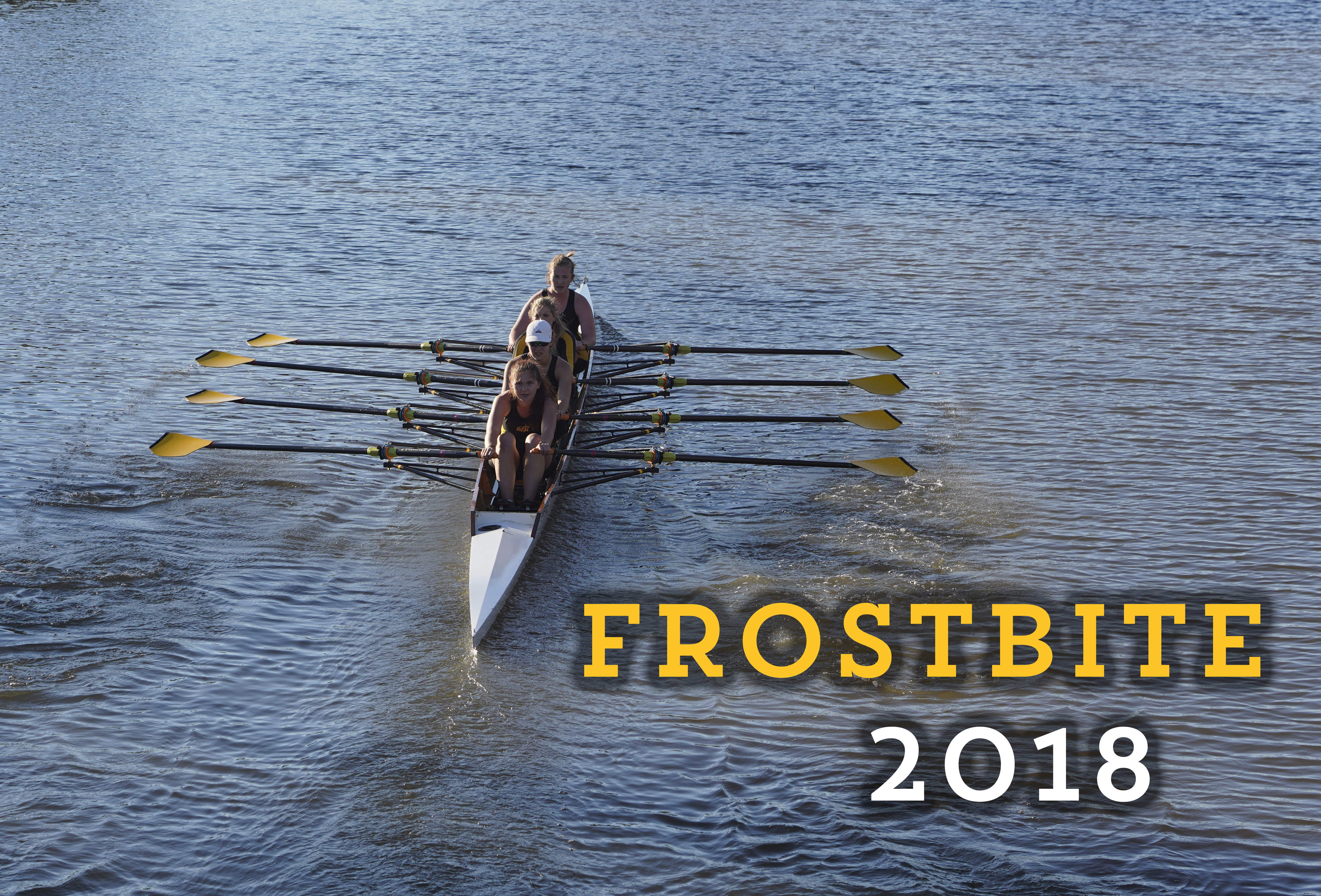 the women's quad rowing down the river at the frostbite regatta