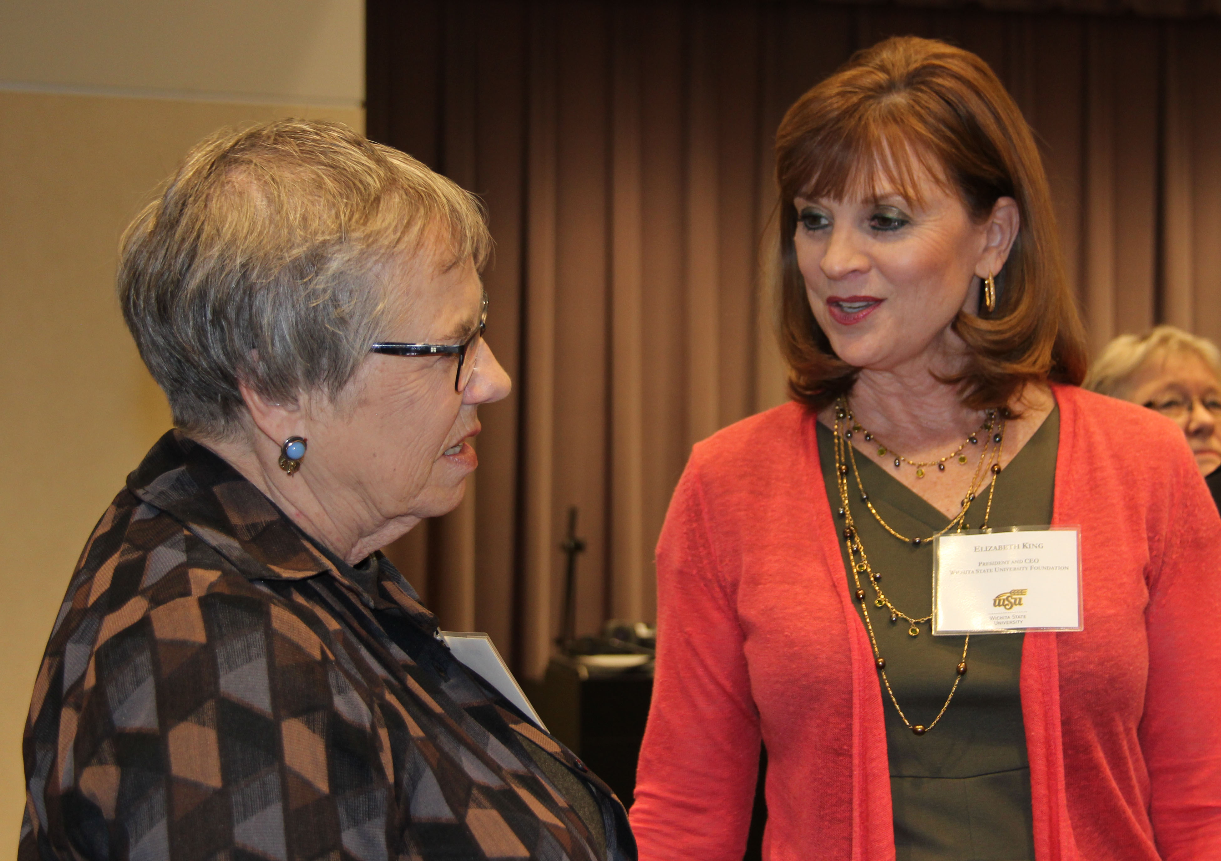 Photo of AET New Inductee Donna Wolfe visiting with Elizabeth King.