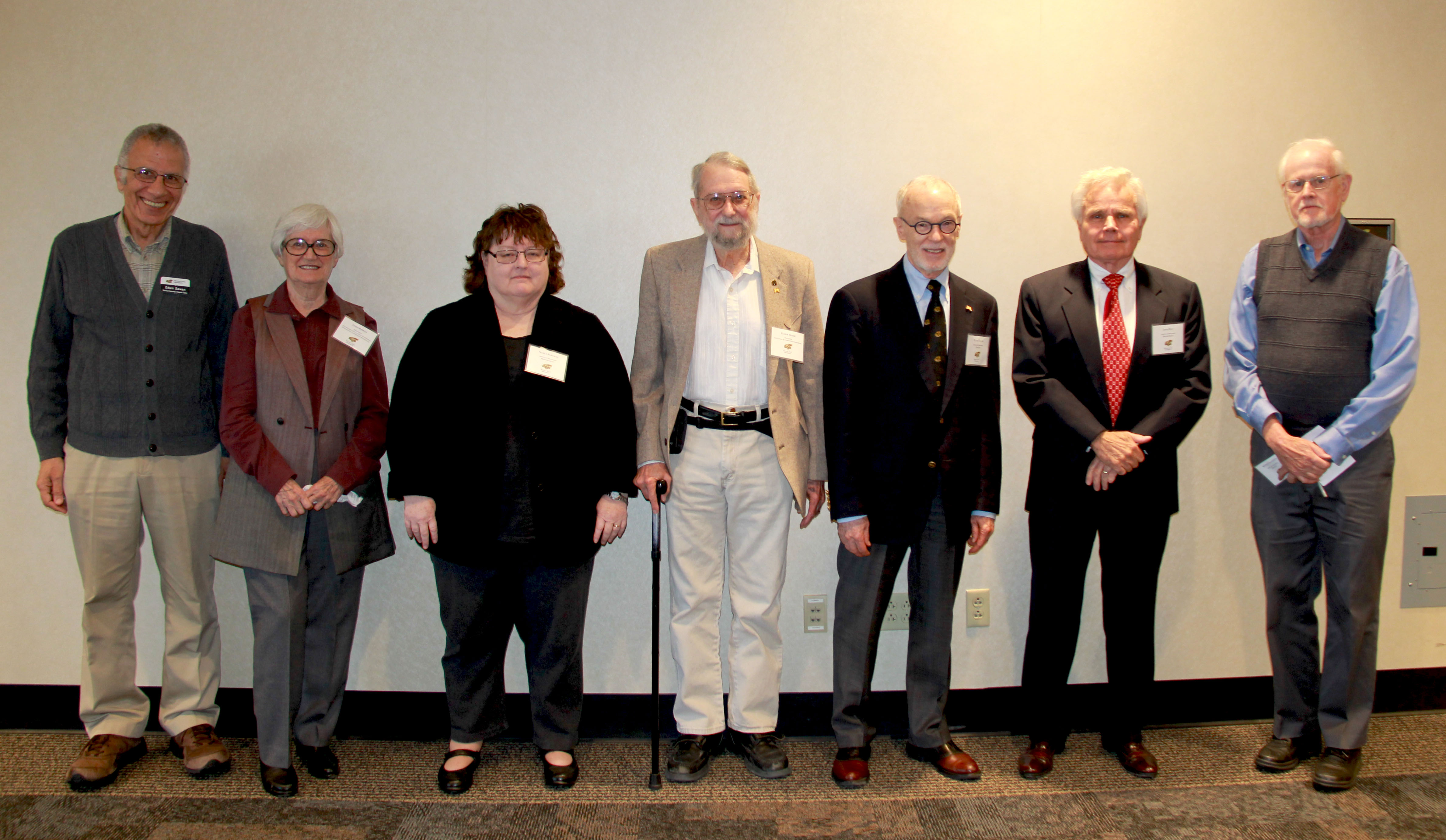 Photo of the Steering Committee - Ed Sawan, Linda Bakken, Nancy Bereman, Elmer Hoyer, Peter Zoller, John Belt, Arthur Youngman. Not shown: William Woods. 