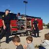 Children learn from local fire department officials