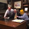 Having fun with John Tomblin (left) and Lou Heldman (right, in mask) in his office.