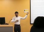 A man  presenting his pitch during a training session.