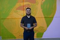 Abel Barraza received an award at the 2024 Inaugural Latine Graduation. 