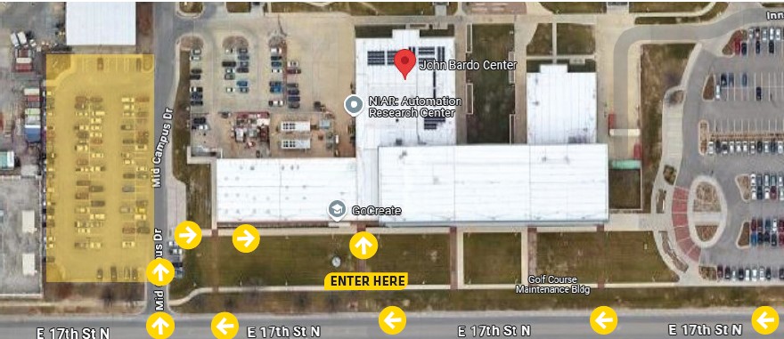 Aerial view of JBC building with arrows navigating how to get to the building and where to park