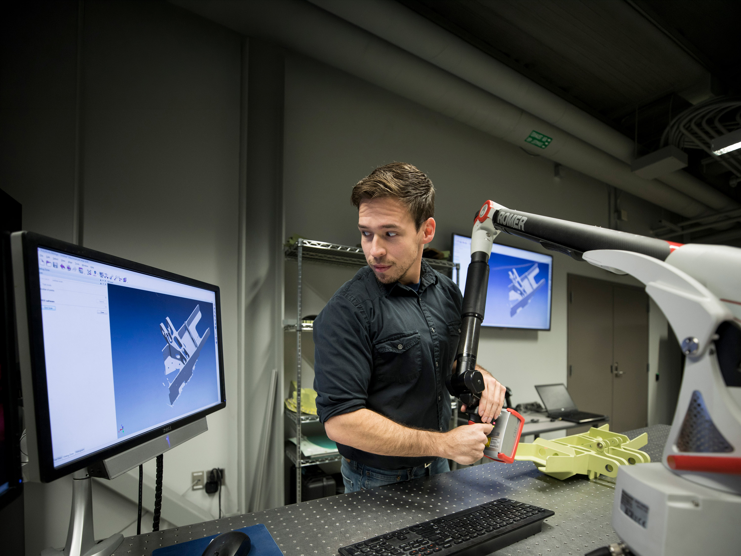 Student working on a machine in the Reverse Engineering Laboratory.