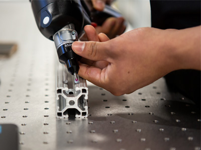 AMP employee demonstrating geometric dimensioning and tolerancing analysis