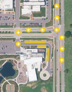 Aerial shot of the DRTH building with arrows showing how to enter the campus from Oliver St. and yellow boxes highlighting where visitors can park