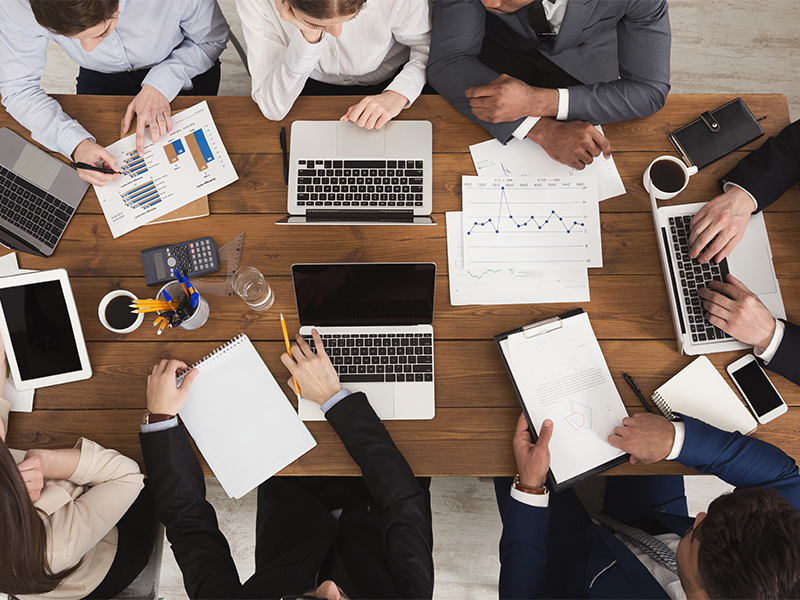 People having a meeting discussing charts and graphs