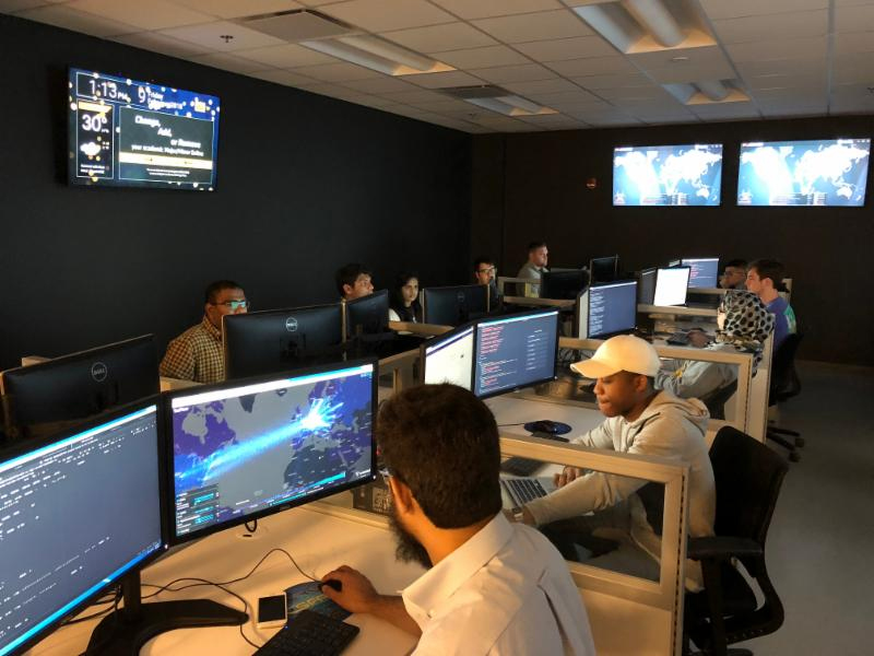 Photo of people in a cyber security lab