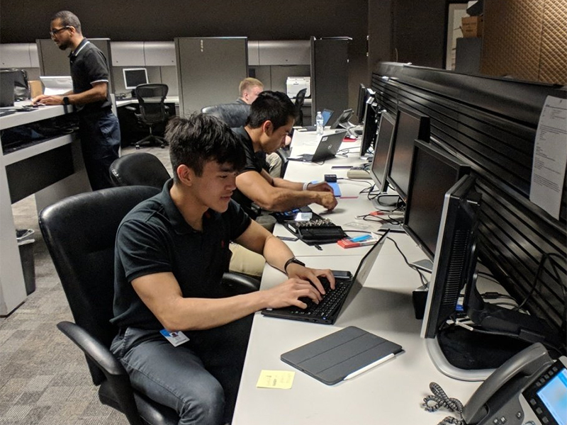 A photo of students working at the Textron Help Hangar